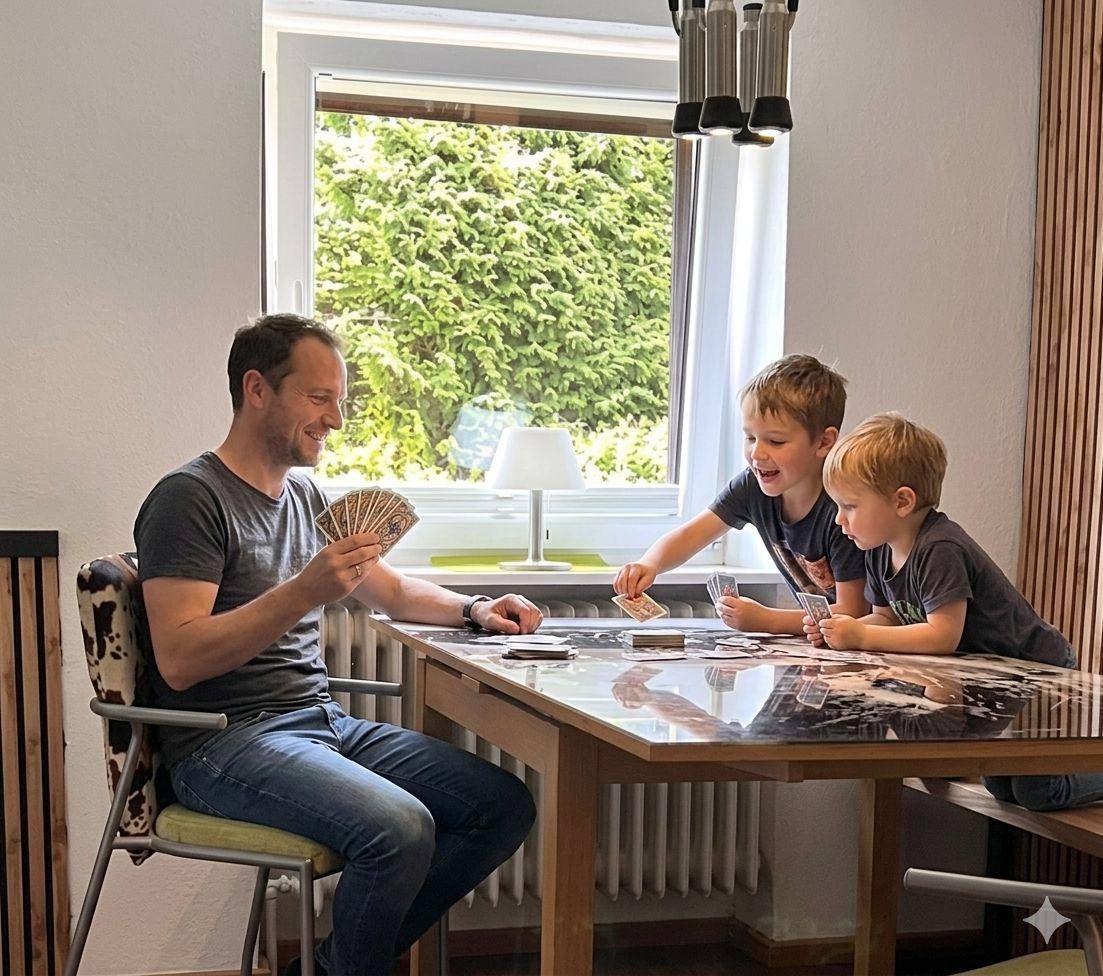 Papa mit Kindern in der Ferienwohnung Gänseblümchen